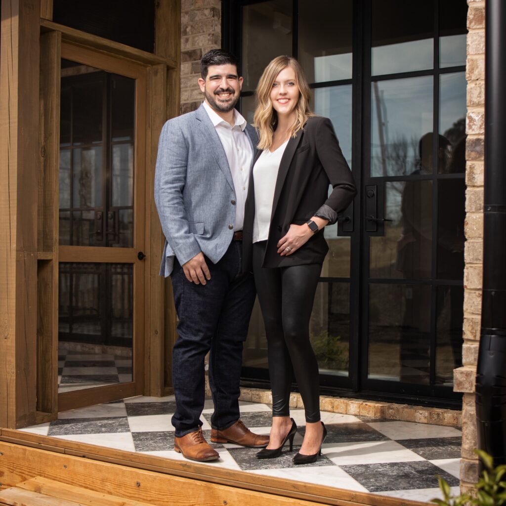 Gabe and Ashley Arronte at the front door of a home